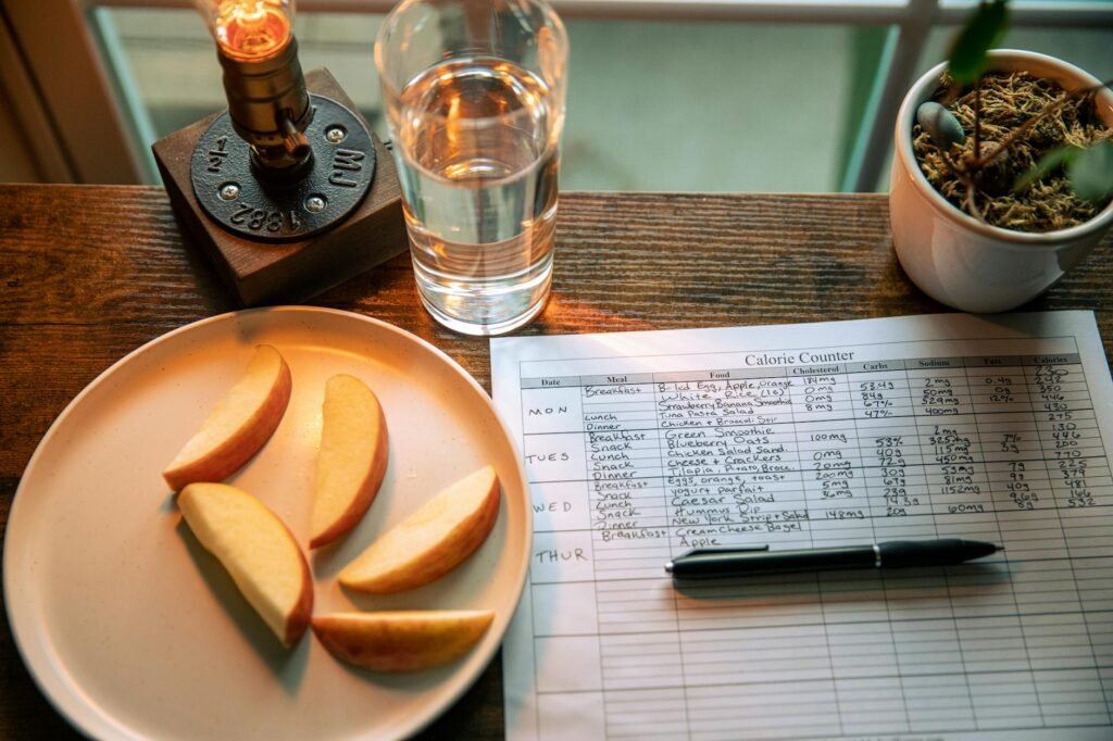 A grocery receipt and handwritten meal plan on a kitchen countertop