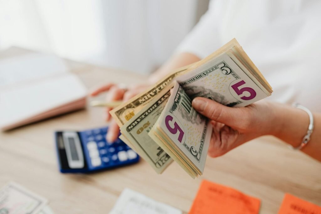 A budget worksheet and reminder note for an automatic payday savings transfer.