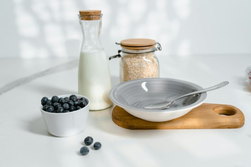 Prepared overnight oats and fruit on a kitchen counter ready for the next morning